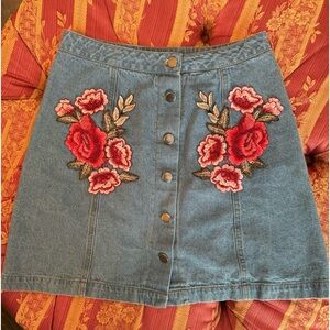 Jean Mini Skirt w/ Appliqué floral design, and button front—